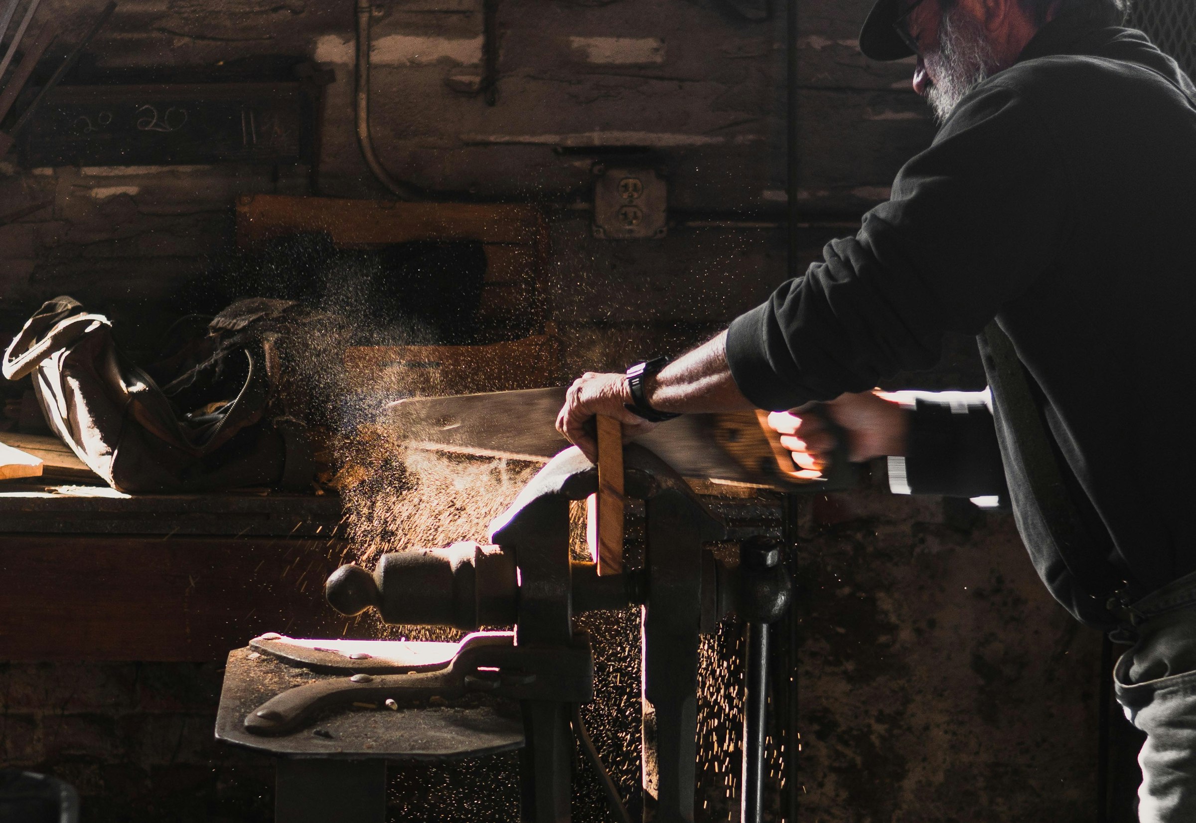 Craftsman at work in a dim workshop